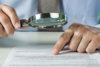 Magnifying Glass Over a Document